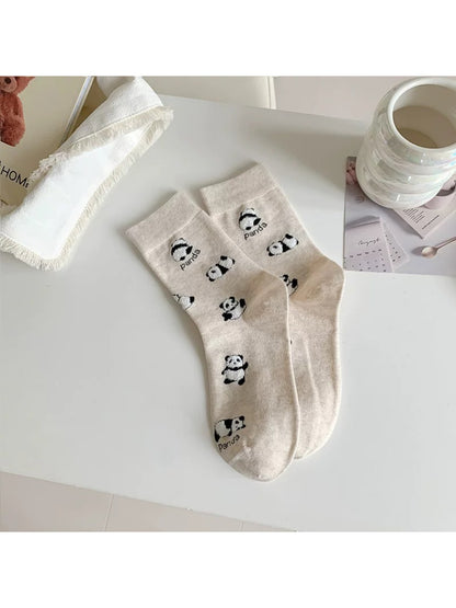 Packaging of Rufia Playful Panda crew socks with panda illustration and branding