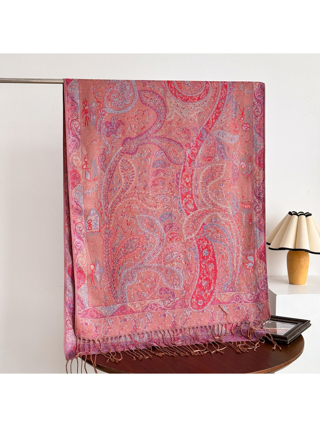 Model wearing bohemian paisley fringe shawl outdoors
