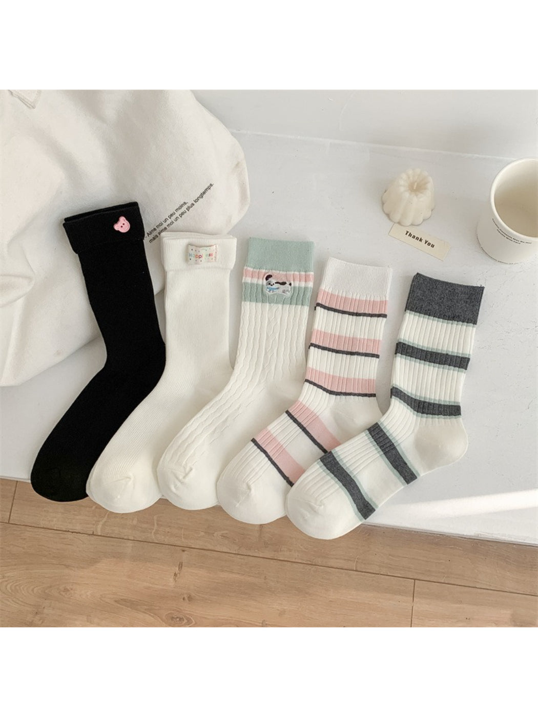 Close-up of Rufia crew socks showing detailed multicolor stripes and soft fabric texture