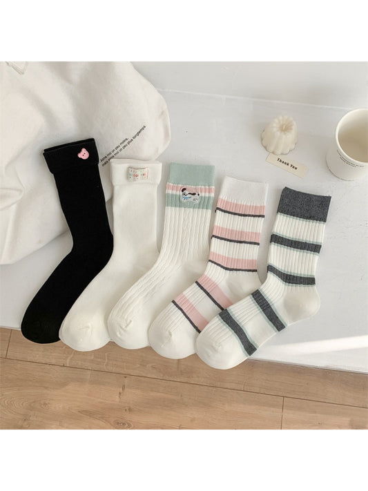 Close-up of Rufia crew socks showing detailed multicolor stripes and soft fabric texture