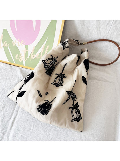 Cosbai Abstract Floral Slouch Shoulder Bag worn on shoulder by model