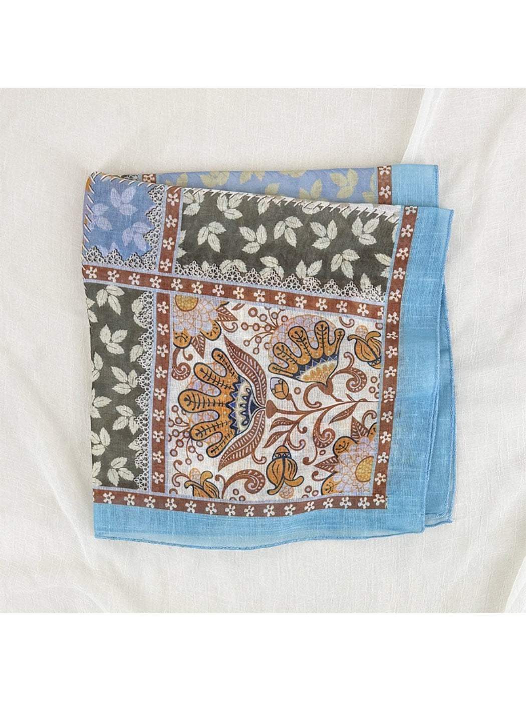 Scarvii square scarf laid flat displaying full patchwork floral border pattern