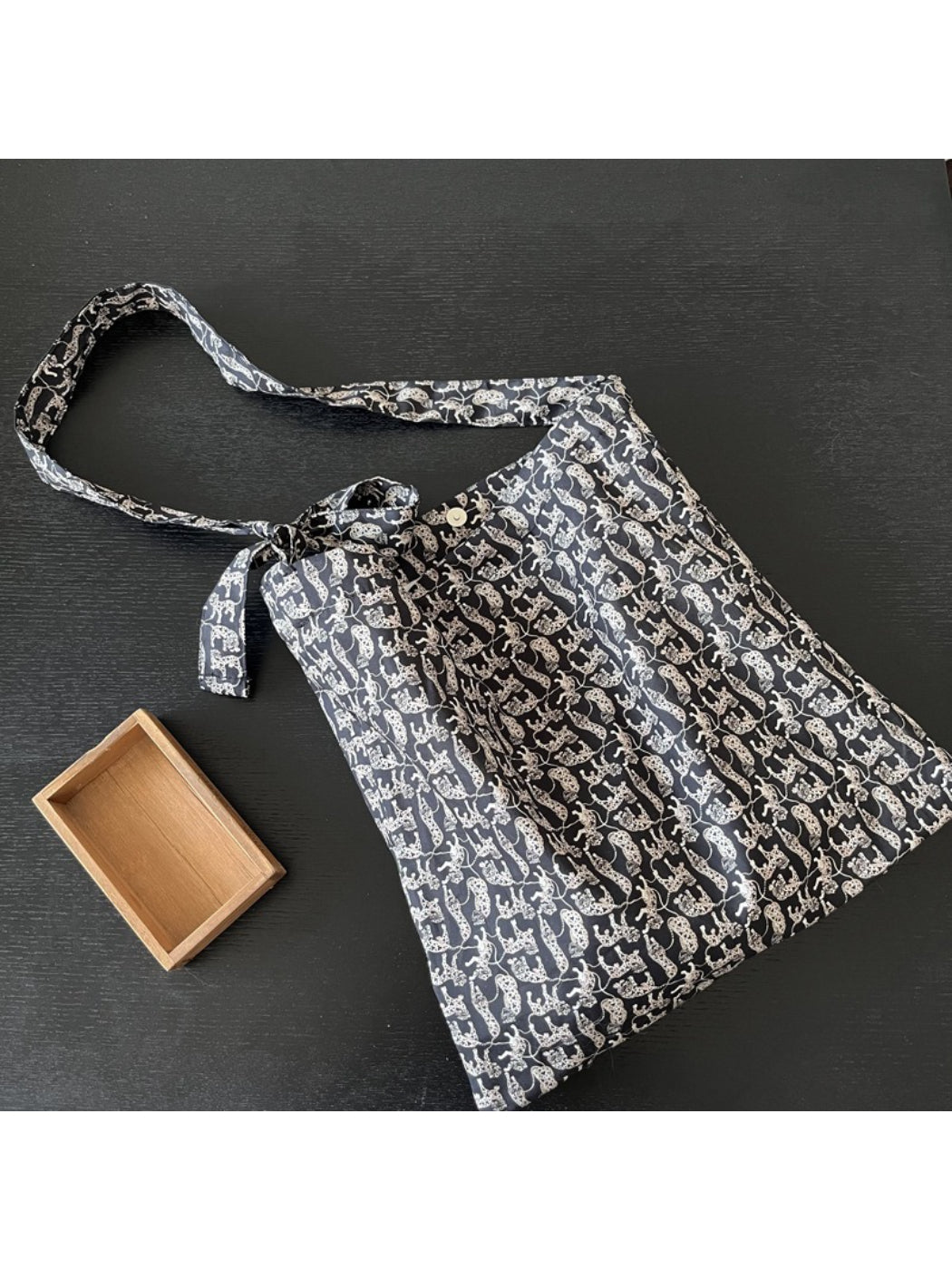 Cosbai tote bag folded compactly for easy storage and portability