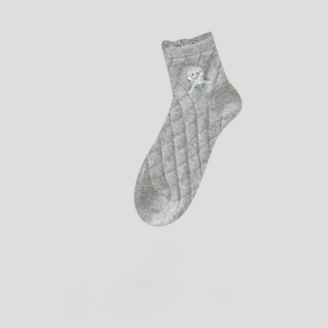 Close-up of the toe and heel area of Rufia Sweet Bear Diamond Knit Socks in beige and brown