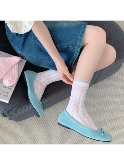 Pair of Rufia sheer wave pattern crew socks in light beige and white