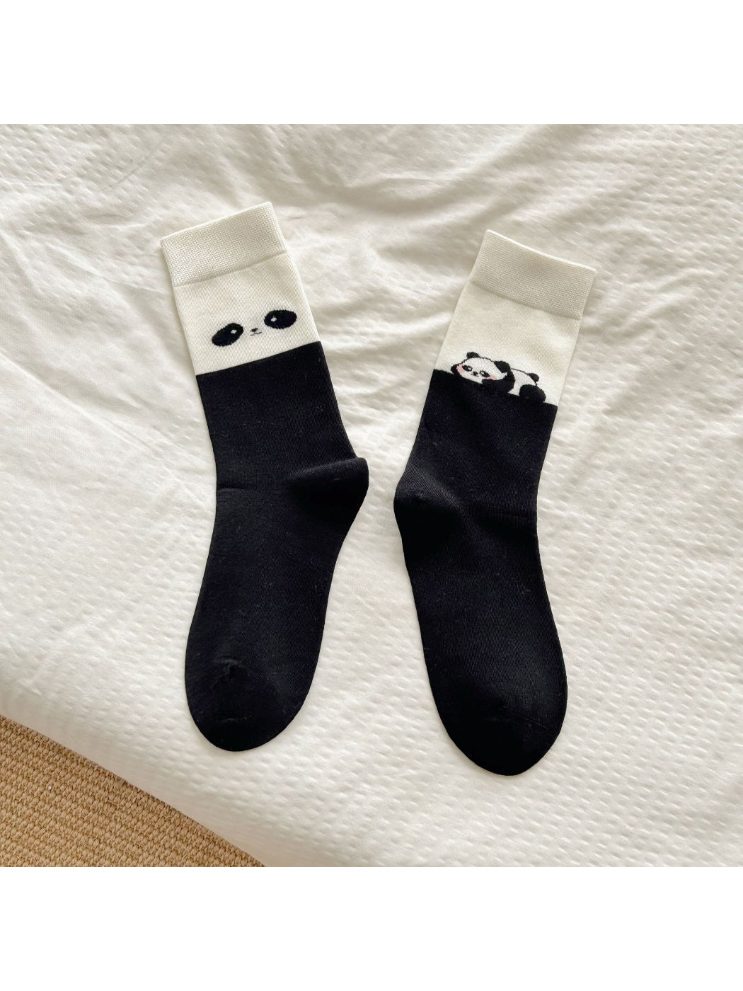 Rufia soft crew socks laid flat highlighting the full bear motif and cream color