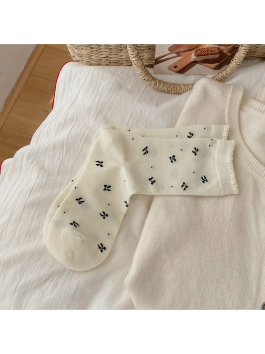 Pair of Rufia soft bow motif everyday crew socks in light beige color