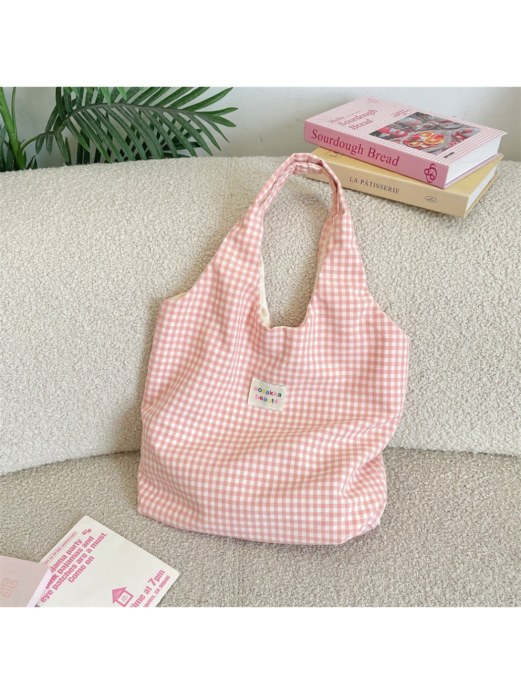 Close-up of Cosbai tote bag showing check pattern fabric and stitching details