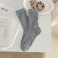 Rufia neutral textured crew socks rolled up to show texture and color