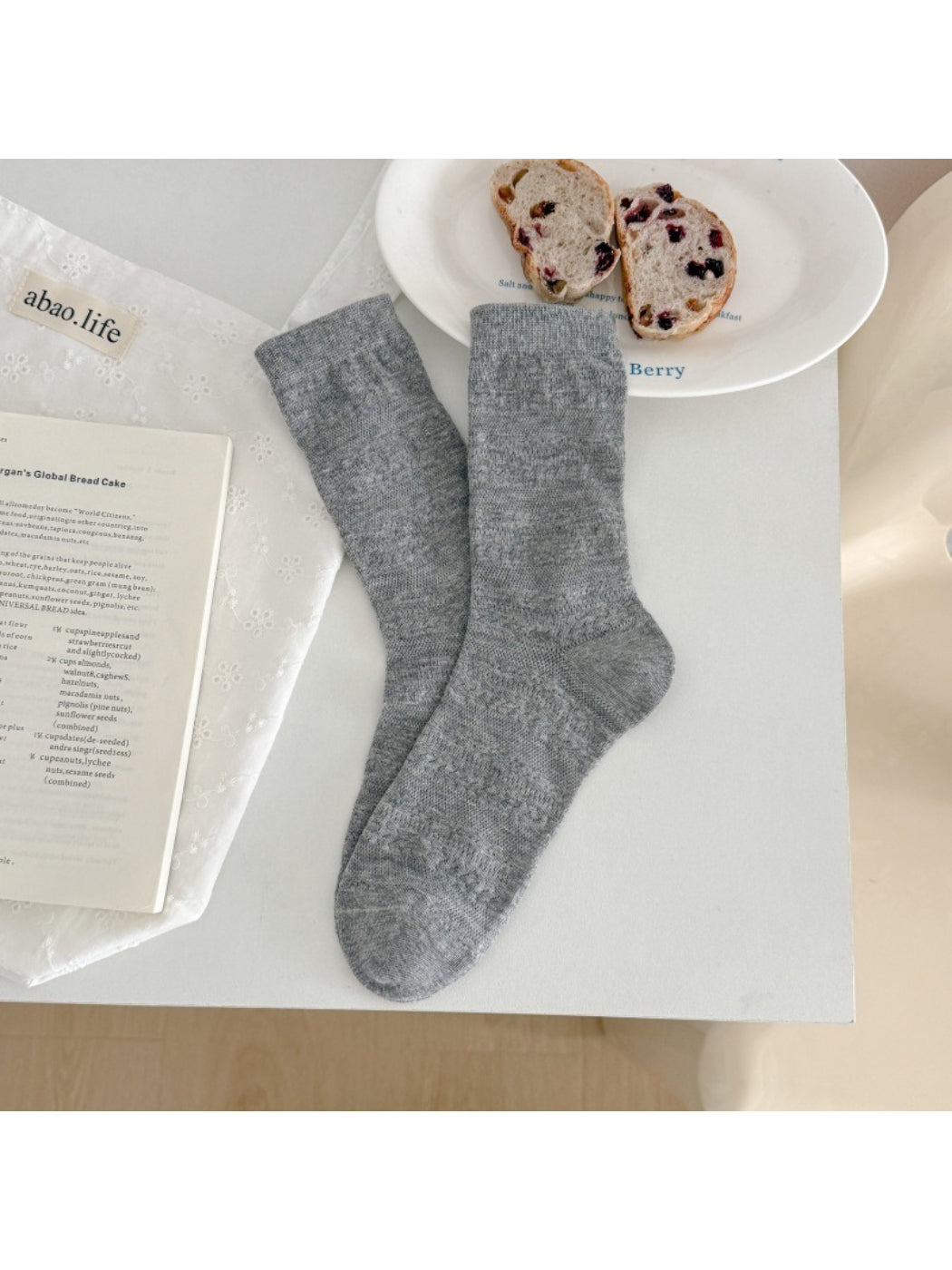 Rufia neutral textured crew socks rolled up to show texture and color