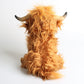 Brown cow plush toy with soft textured body