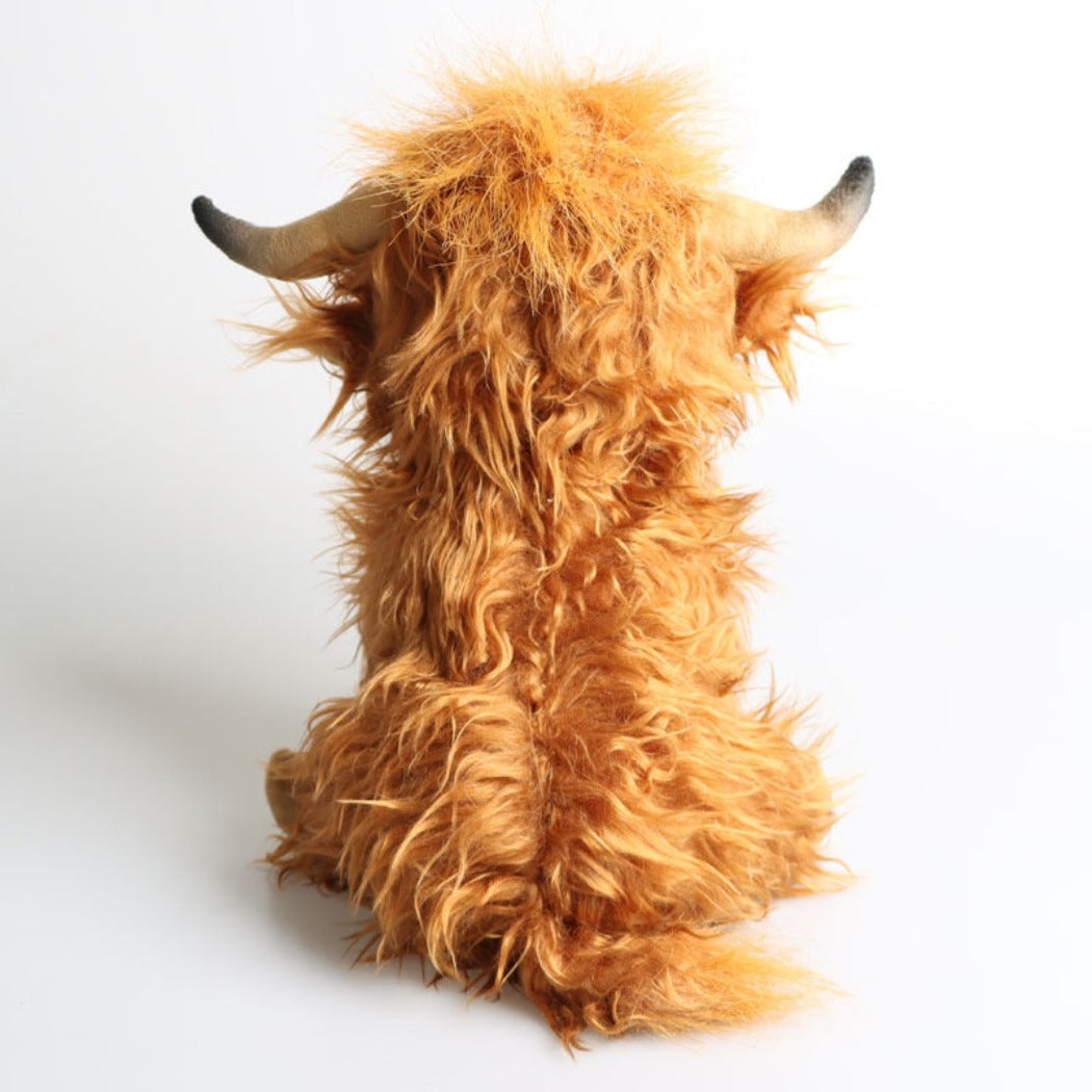 Brown cow plush toy with soft textured body