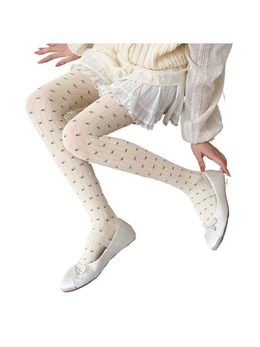 Side view of legs wearing Rufia tiny floral sheer tights paired with a skirt