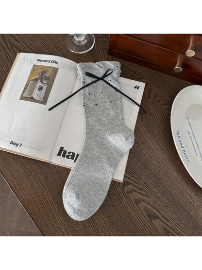Rufia soft ribbed bow crew socks styled with rolled-up jeans