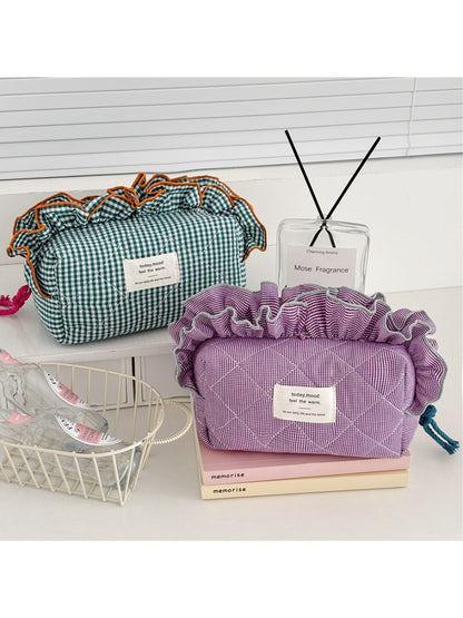 Cosbai ruffle trim gingham makeup bag in black and white check pattern, front view