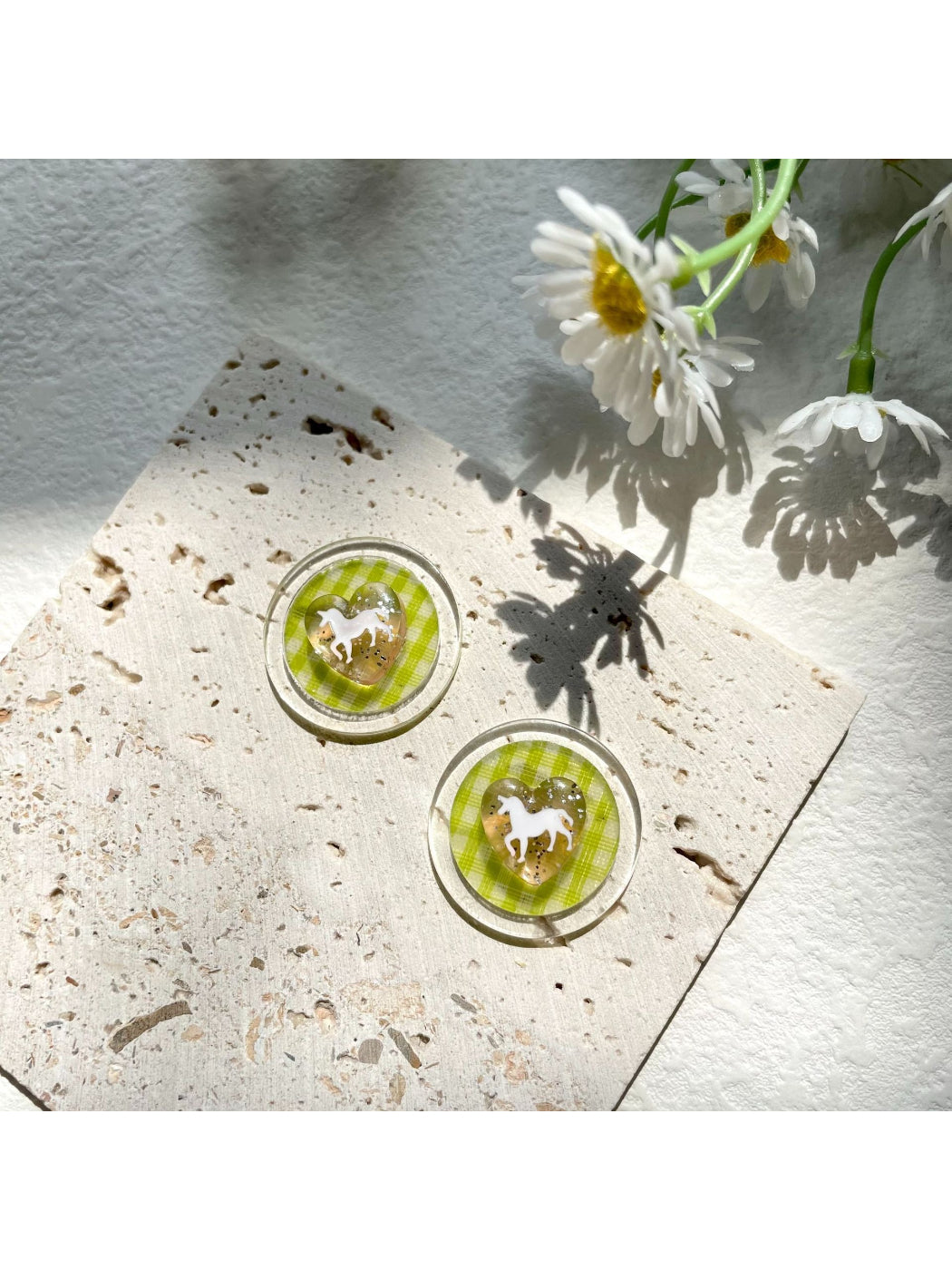 Green check horse earrings shown with matching green accessories