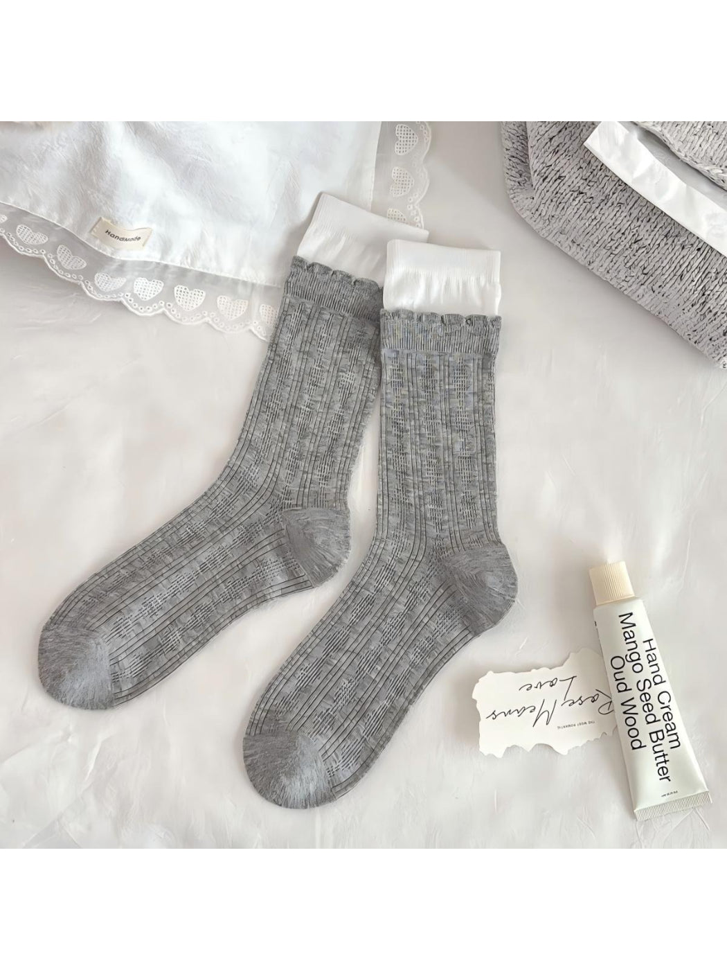 Model wearing Rufia Romantic Lace Cuff Crew Socks with lace trim visible above shoe