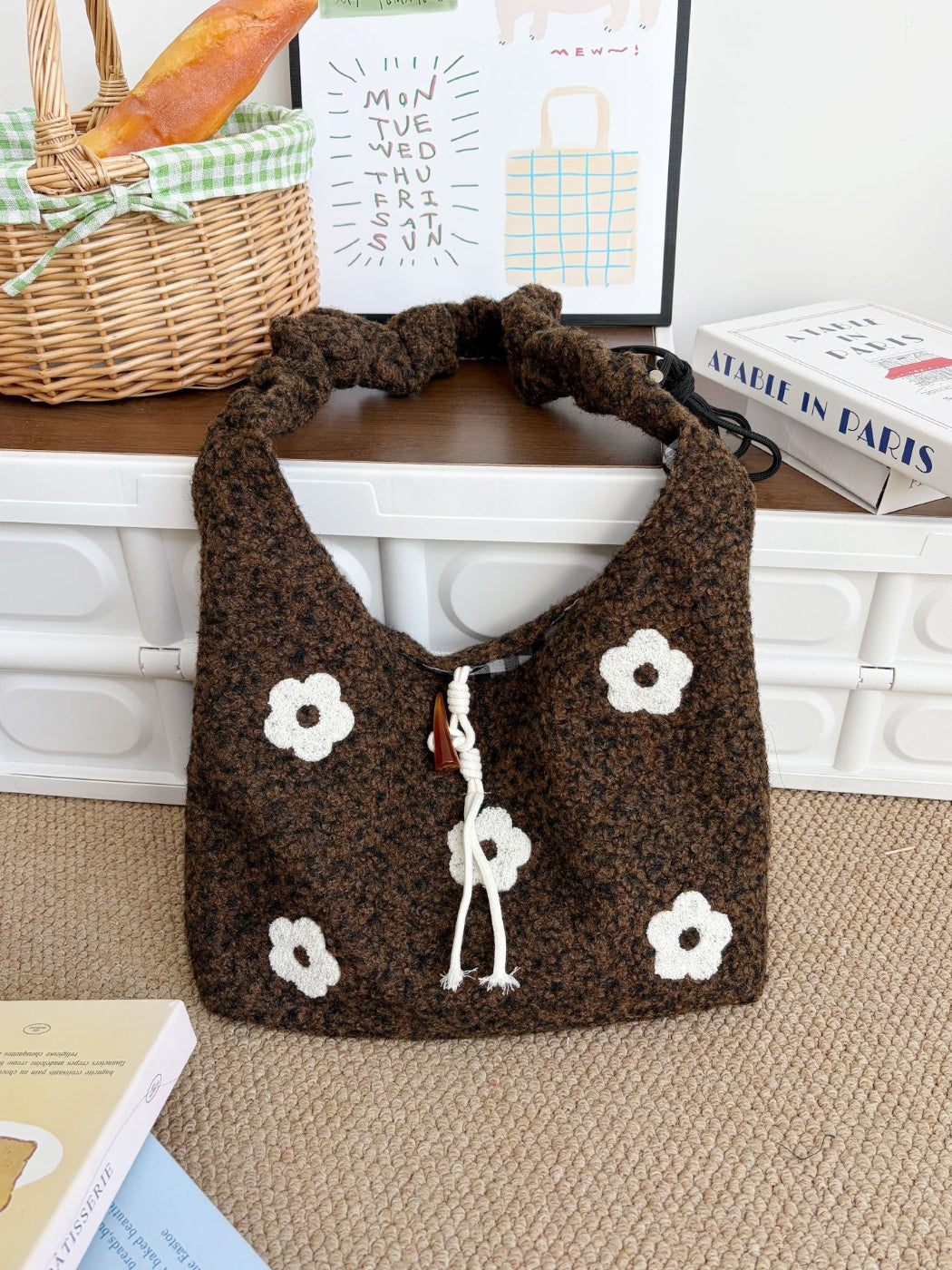 Side view of Cosbai floral knit shoulder bag showing strap and texture