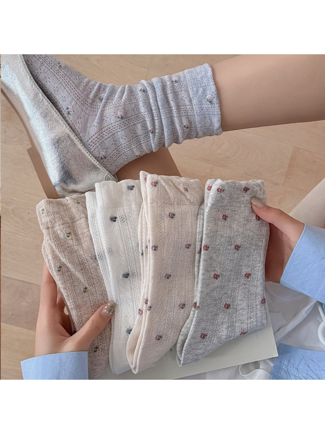 Pair of Rufia tiny floral ribbed crew socks in pastel colors displayed flat