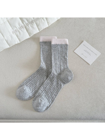 Top view of Rufia colourblock socks emphasizing soft ribbed fabric and color sections