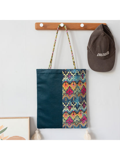 Cosbai Boho Ethnic Tassel Tote bag with ethnic pattern and tassels hanging on hook