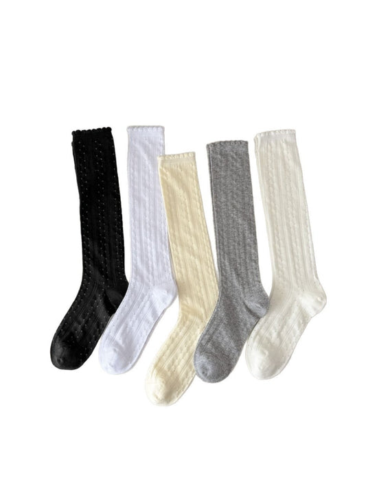 Rufia pointelle knee high socks displayed flat on a white background