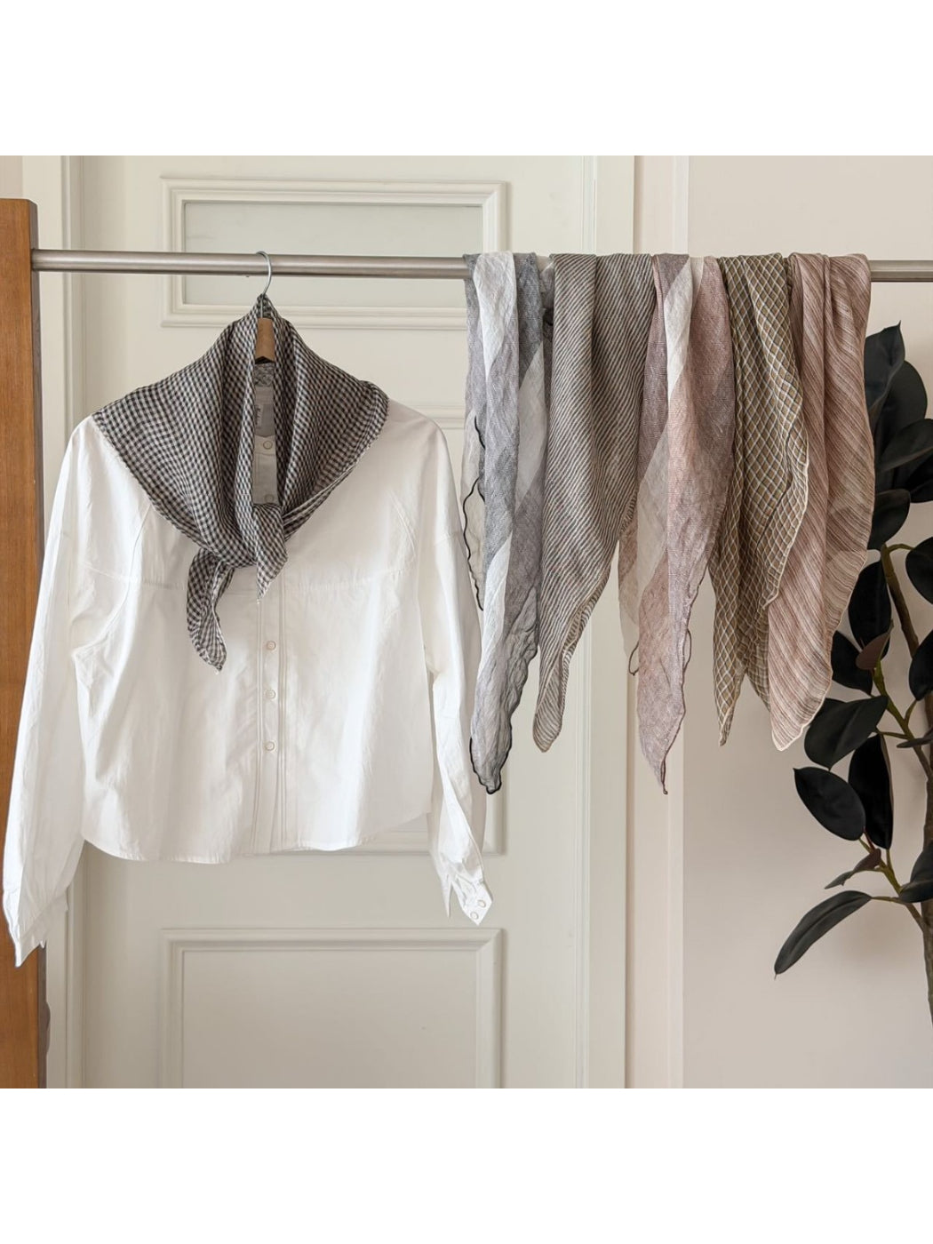 Model wearing soft check bandana scarf around the neck