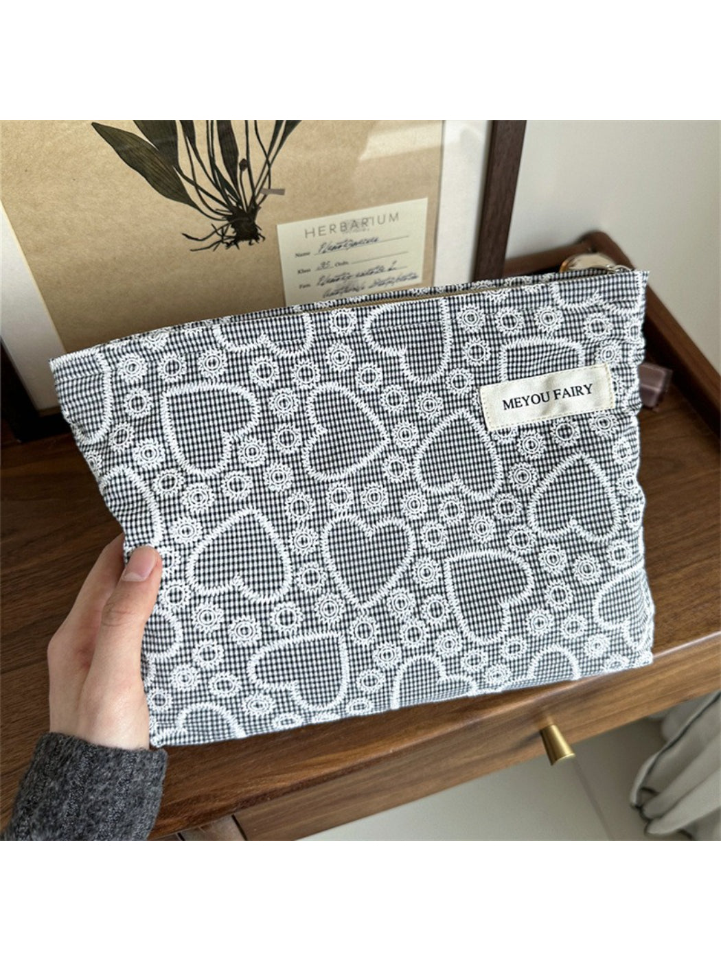 Cosbai makeup bag folded flat showing flexible material and heart print