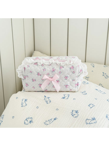 Close-up of pink bow and lace pattern on Cosbai makeup storage bag
