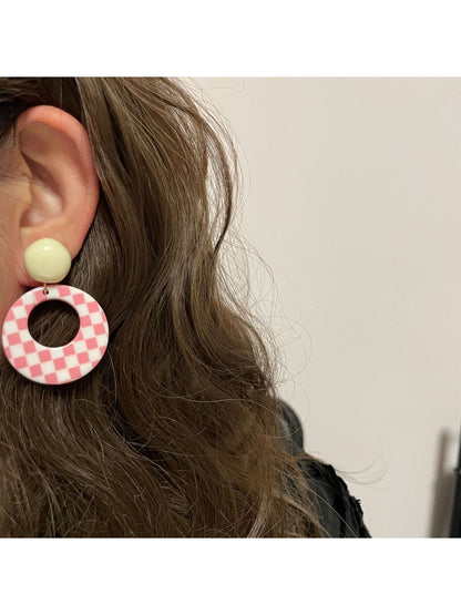 Side angle of Earwish Retro Check Hoop Earrings showing circular shape and check design
