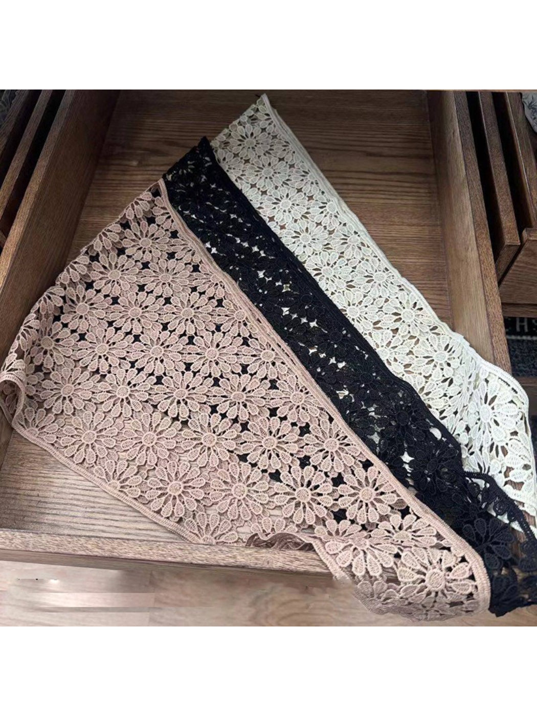Close-up of intricate crochet lace pattern on white head scarf bandana