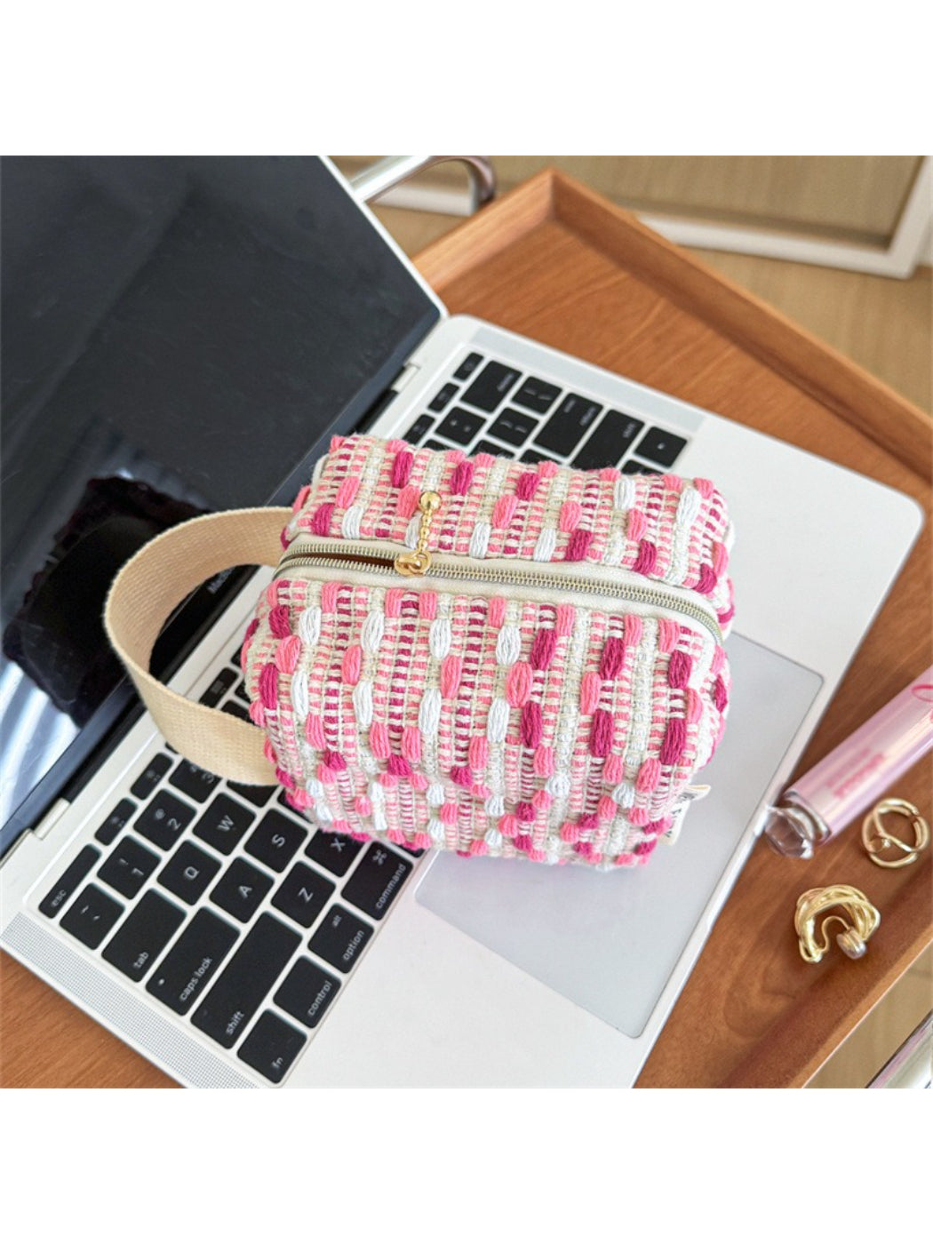 Close-up of Cosbai woven stripe cosmetic bag showing detailed striped pattern