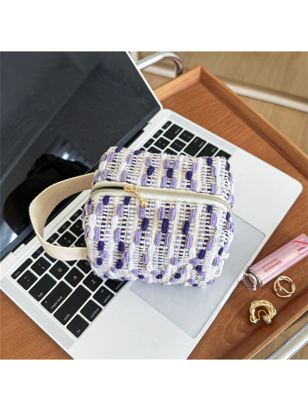 Cosbai woven stripe cosmetic bag laying flat showing full striped design