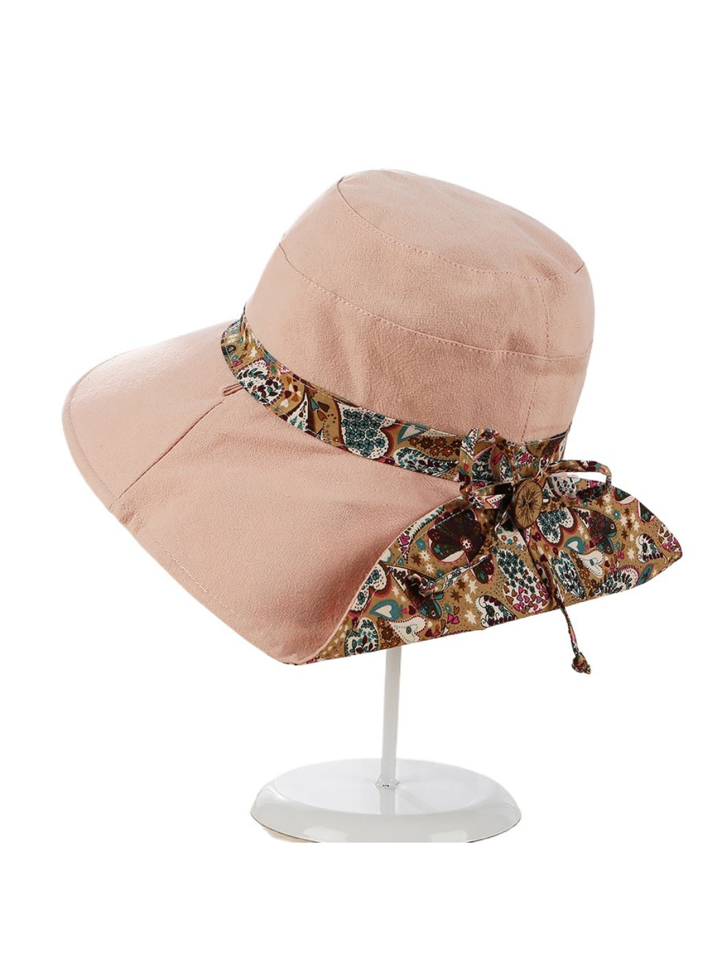 Side view of the Haila sun hat highlighting the wide brim and paisley ribbon
