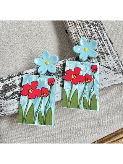 Side view of Earwish Painted Flower Drop Earrings showing metal hooks and painted flowers