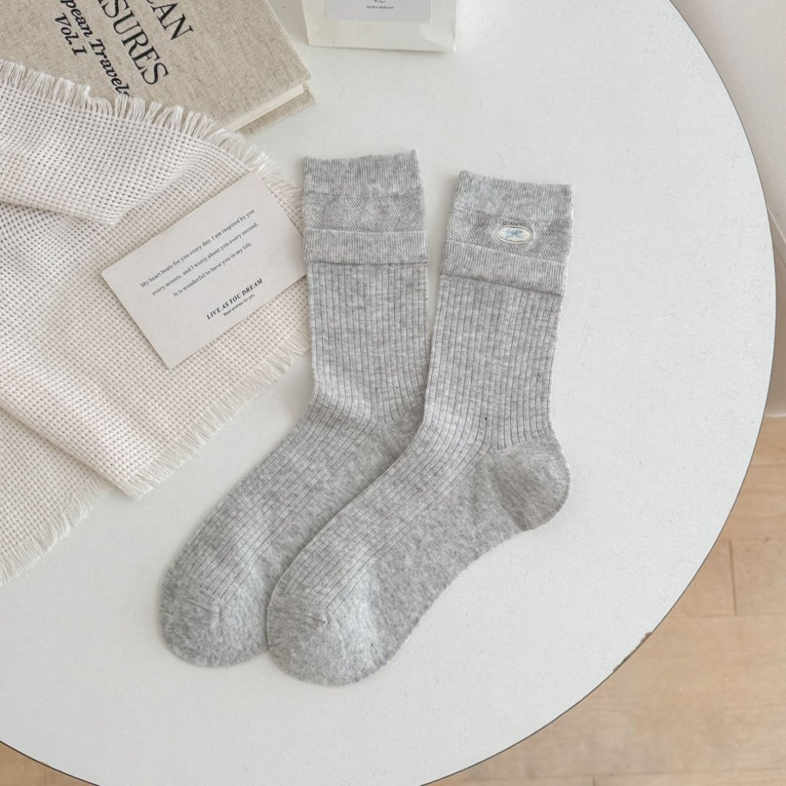 Rufia socks displayed with turnover cuff rolled down