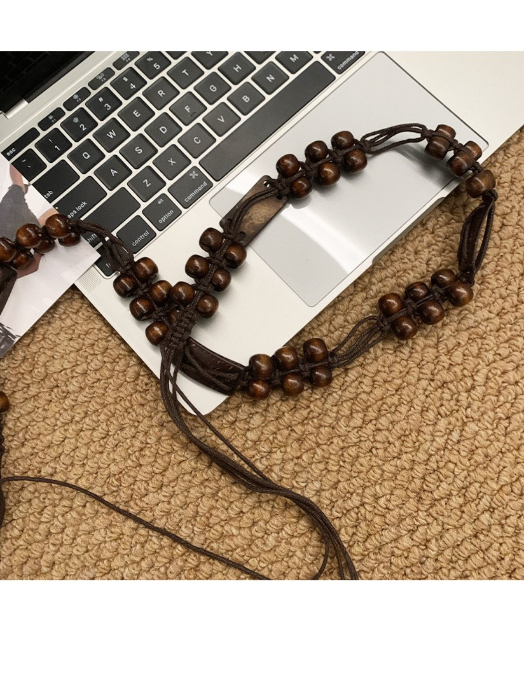 Side view of Beco brown beaded tie waist belt highlighting bead details and texture