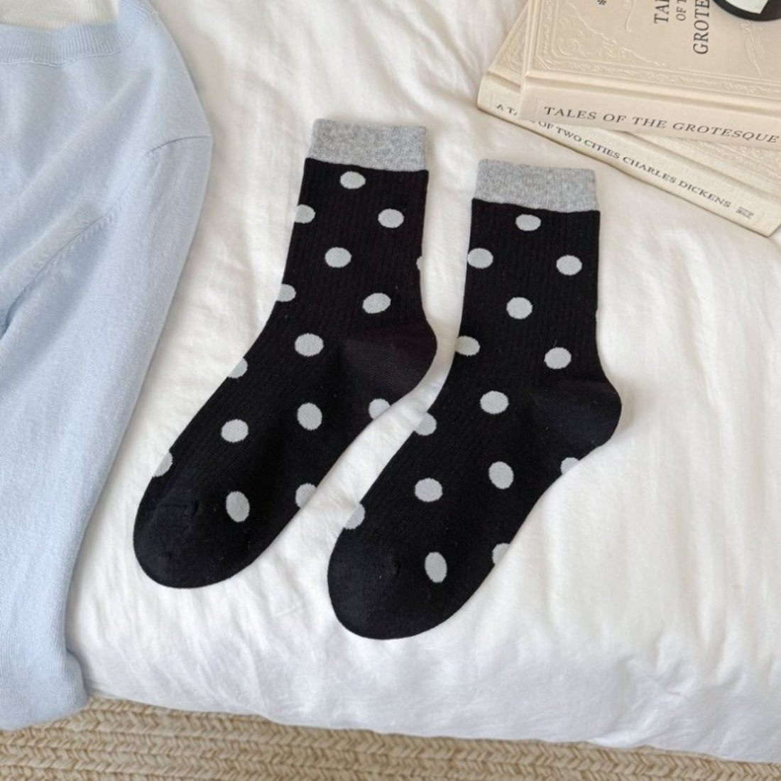 Rufia mid-calf socks arranged to highlight color block contrast and dot pattern