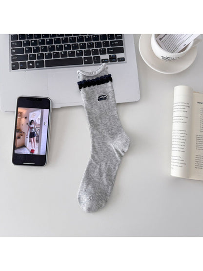 Rufia contrast braid knit socks folded neatly showing the knit detail and color contrast