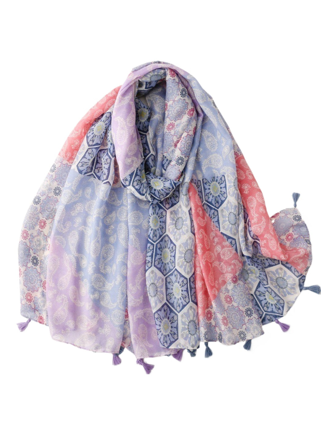 Pastel patchwork scarf with tassels draped over a wooden chair