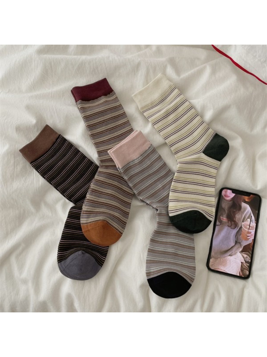 Pair of Rufia Fine Stripe Everyday Crew Socks in neutral tones displayed flat