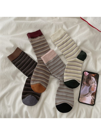 Pair of Rufia Fine Stripe Everyday Crew Socks in neutral tones displayed flat