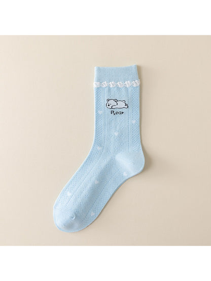 Top view of Rufia crew socks showing blue cuff and white body