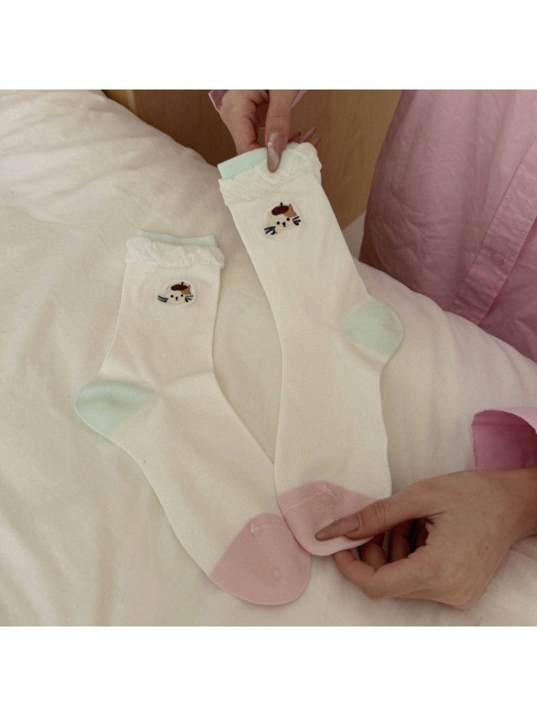 Model wearing Rufia twisted cuff cat detail socks with casual shoes