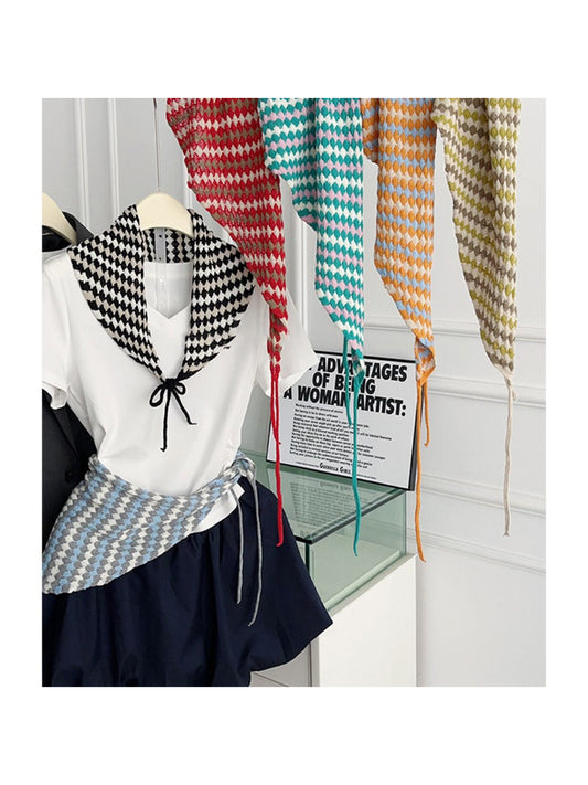 Open knit diamond triangle scarf in cream color displayed flat