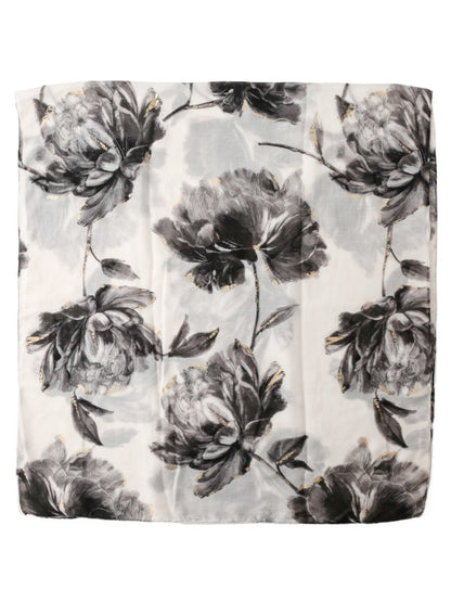 Scarvii scarf draped over a chair highlighting soft fabric and floral design