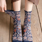 Rufia Heart White Mid-Calf Socks arranged to show both front and back views