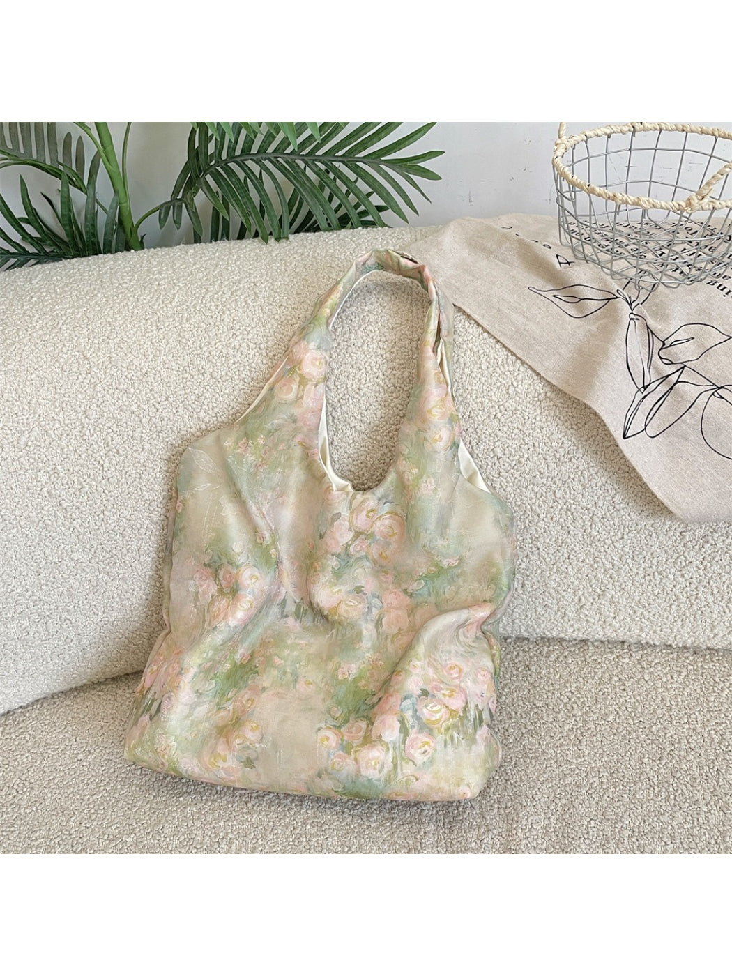 Side view of Cosbai vintage floral hobo bag highlighting its curved shape and accents