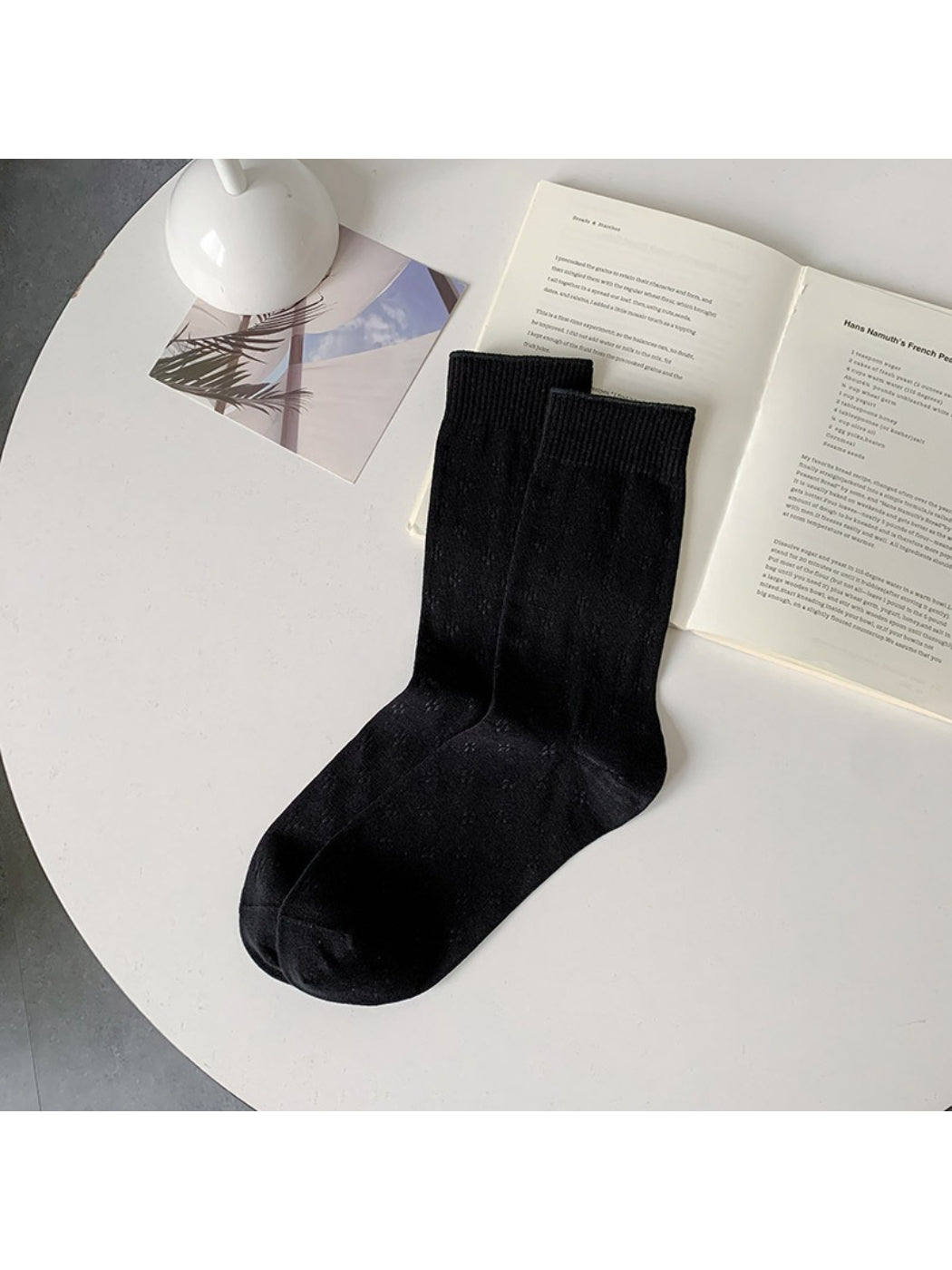 Rufia knit white crew socks folded neatly with visible knit design