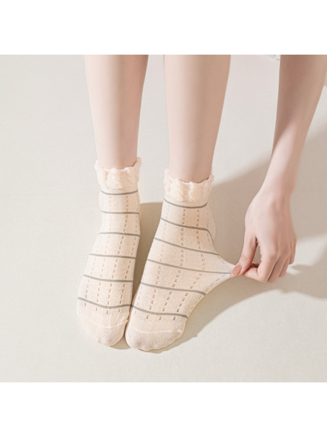 Model wearing Rufia frill trim striped ankle socks with casual shoes